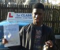 Sam Kilajedo with Driving test pass certificate